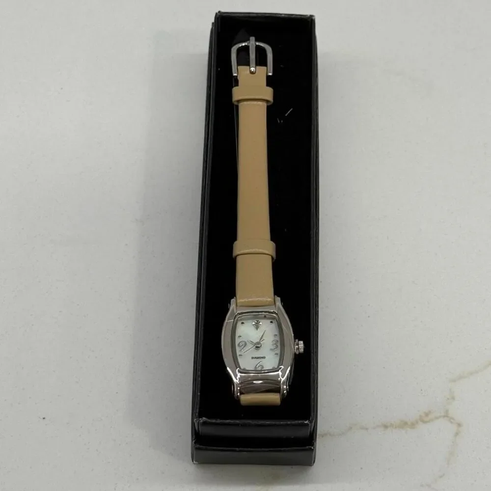 Avon 2009 Diamond accent watch with MOP dial taupe